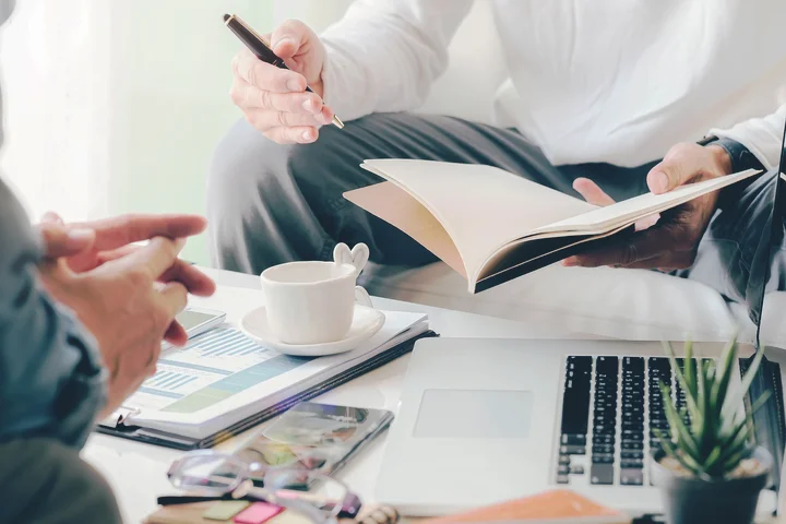 New York personal injury lawyer meeting with a client, reviewing documents and explaining options.