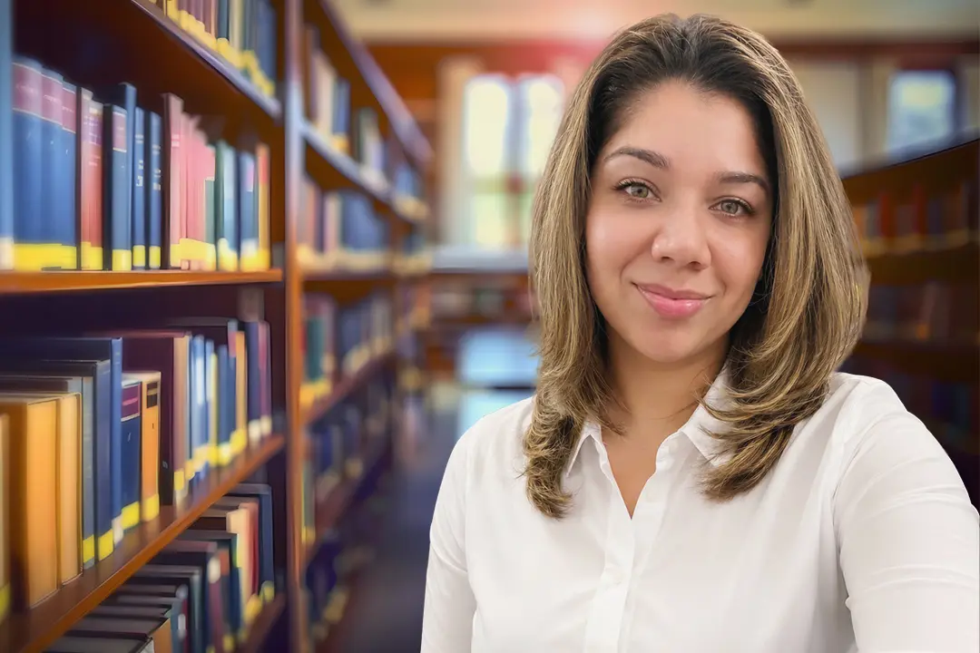 Marlene Torres, senior litigation paralegal, pictured in a law library setting